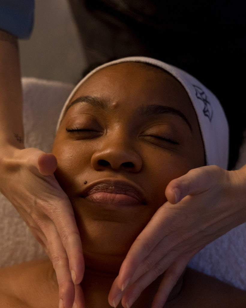 a black woman having a facial wearing a pfeffer sal headband